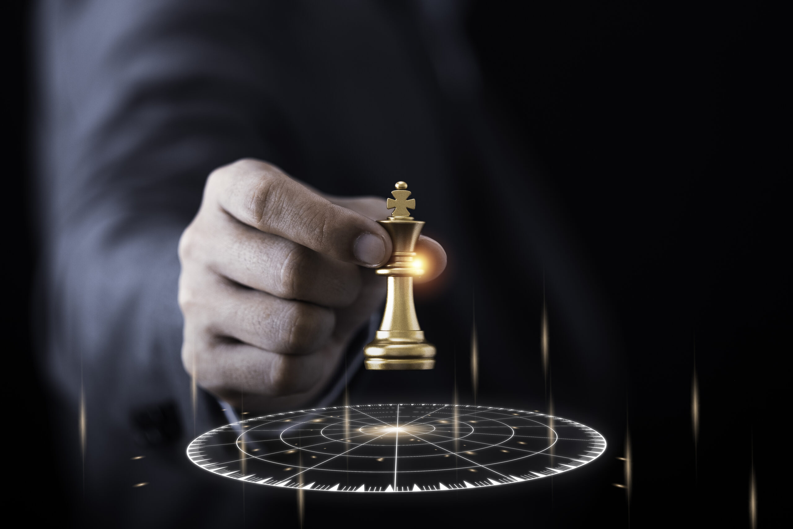 Businessman holding and throwing golden king chess to virtual ta